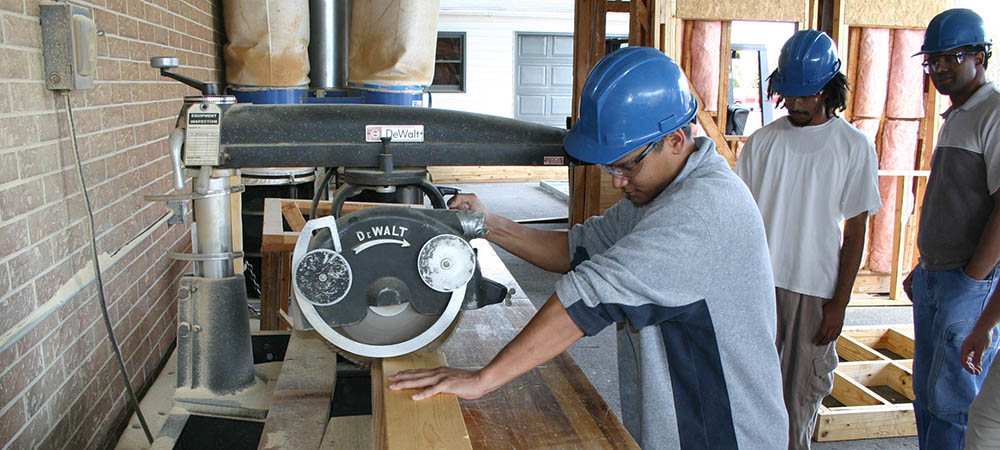 Carpentry student using table saw