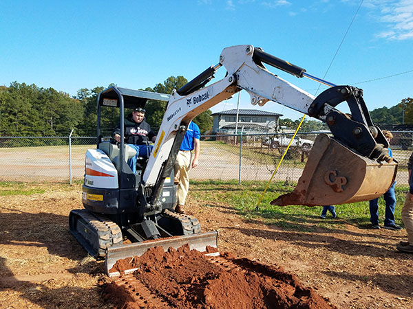 Baldwin High School and CGTC Dual Enrollment Student, Johnny Parker, operates an excavator during an exhibit at the Central Georgia and Southern Crescent Workforce Development Alliances’ second annual Skills Challenge in early November.