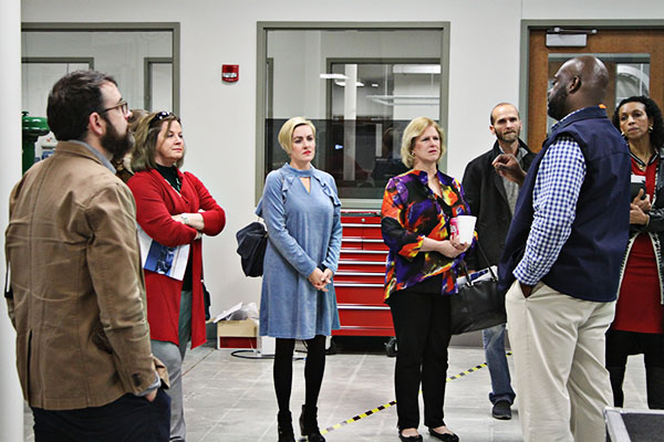 Tony Shelley (far right), program chair of Industrial Maintenance, leads a tour of OneMacon members in the Charles H. Jones building of CGTC’s Macon campus. 