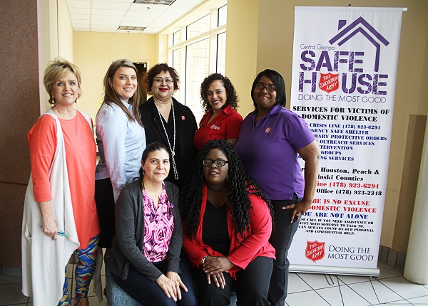 A group of seven females gather for a photo in the lobby of A-Building.