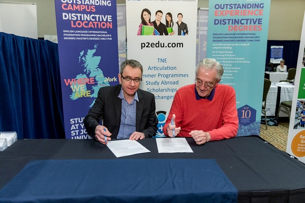 Professor Rob Aitken deputy vice chancellor, Research and International, at York St. John University, and Rick Hutto, executive director for Global Initiatives at CGTC sign an articulation agreement during the Community Colleges for International Development conference in February. 