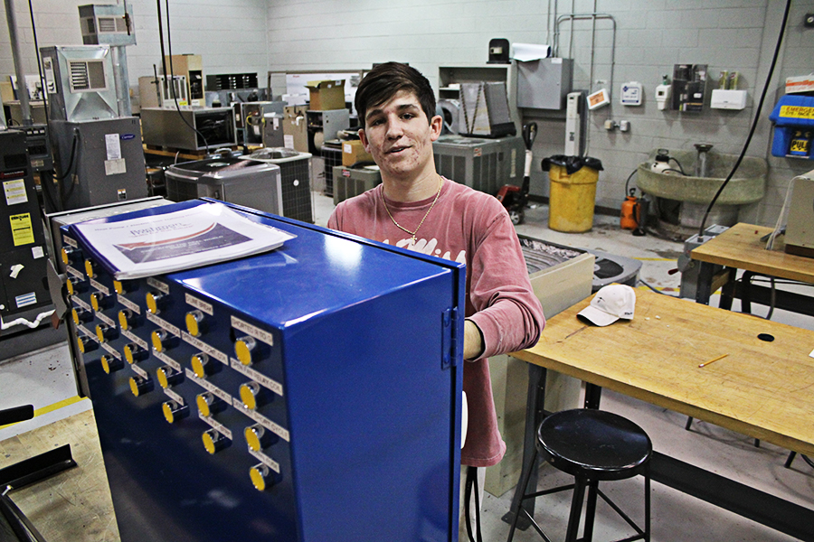 Adam Brooks, CGTC’s first-ever High School Postsecondary Graduation Option graduate works in the Air Conditioning Technology lab on the Macon Campus. 