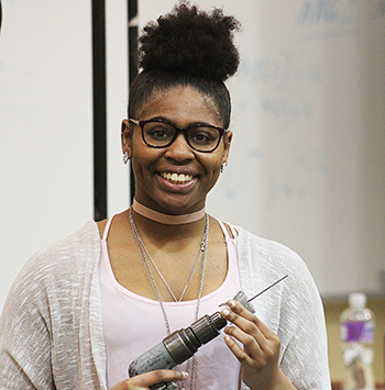 Jazmine Bishop loads a drill bit during her Aircraft Structural course. 