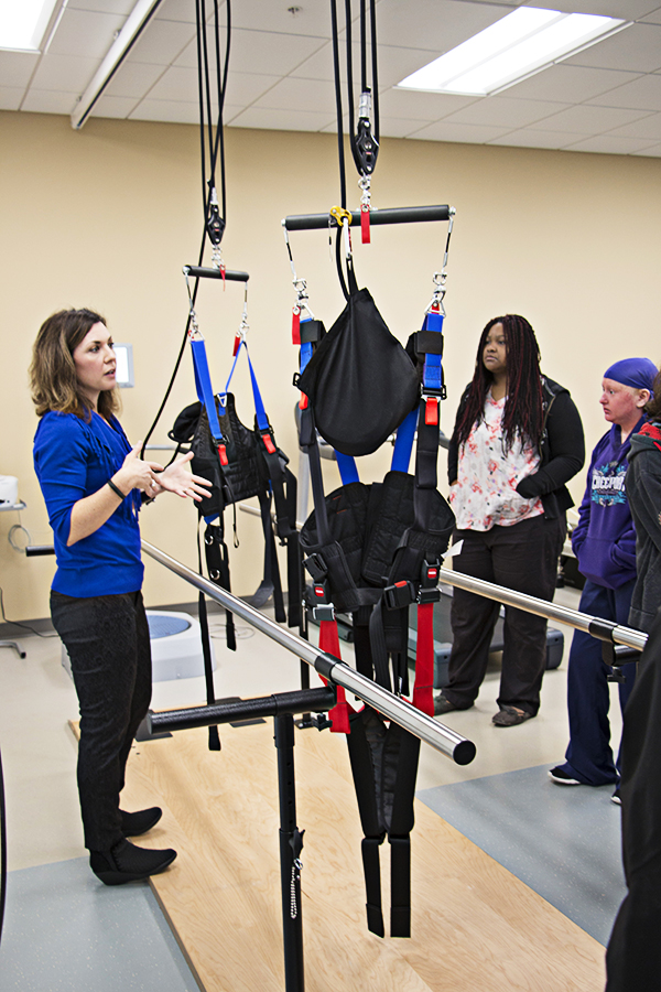 Houston County Career Academy students visit the PTA program lab on the Warner Robins campus of CGTC. Mary Walker, program chair for the PTA program, shares how some of the state-of-the-art equipment is used. 