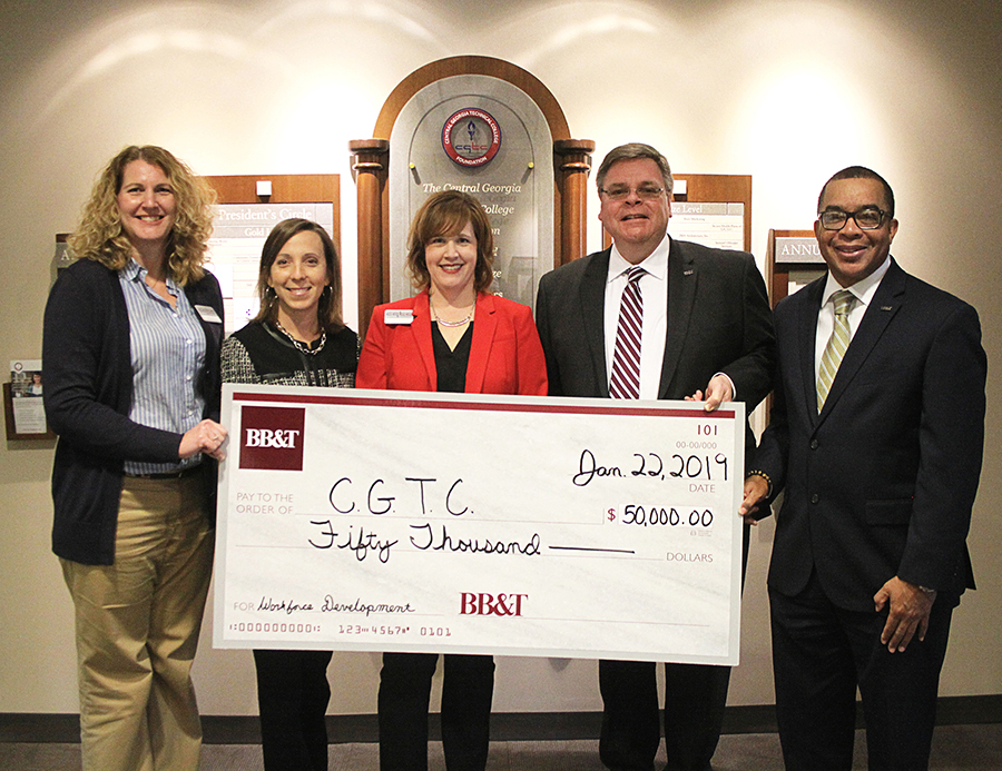 (From left to right) CGTC’s vice president for Administrative Services, Dr. Michelle Siniard, vice president for Economic Development, Andrea Griner, and assistant vice president for Advancement, Tonya McClure, receive a check on behalf of the College’s Foundation from BB&T representatives, Scott Seigel, market president, and, community development specialist, Derold B. Mciver. 