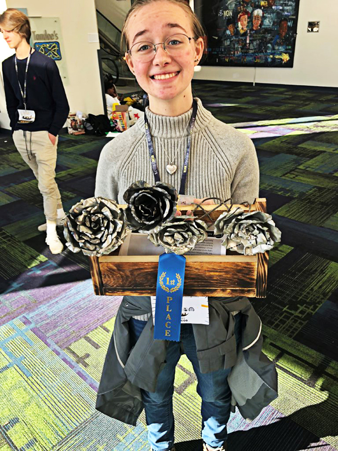Annabell Sapp shows off her metal roses that earned her 1st place in the 80th Annual Senior Beta Convention in January. 