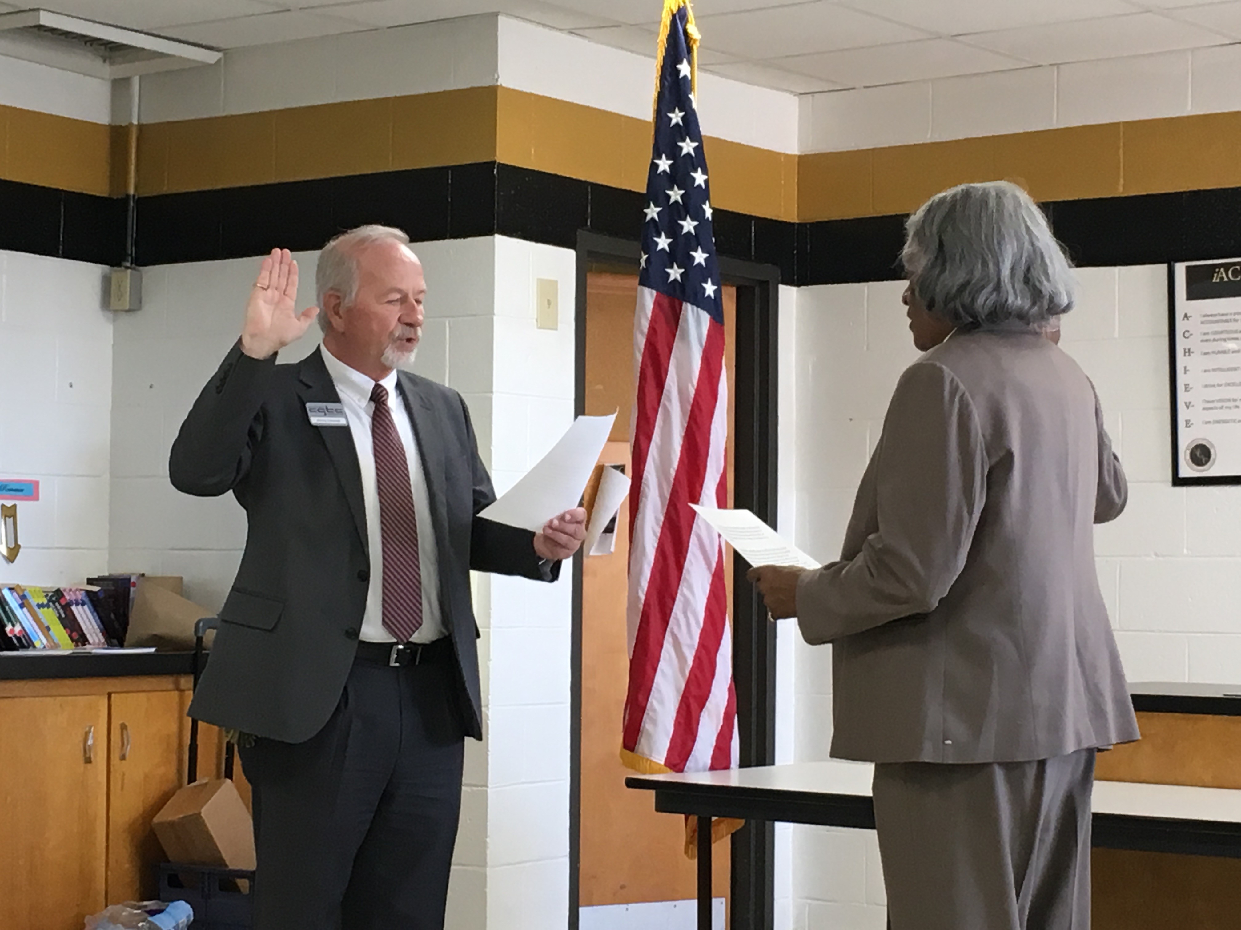 Assistant vice president of Facilities and Ancillary Services at CGTC, James Faircloth, swears in Rev. Dr. Avis Williams during the College’s February Board of Directors meeting.