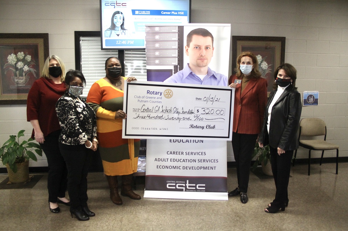 (From Left to Right) Carrie Dietrich, Putnam County Center director, Carrie Dietrich, Putnam County Center director, Carmen Davis, advancement specialist, and Kimberly Hicks-Grable Adult Education site manager and regional lead for Baldwin and Putnam County from CGTC are given a check for adult education scholarships from Lu Byrd, president of the Rotary Club, and Donna O’neal, a previous president.