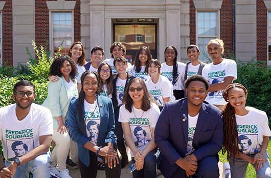 A group of past Frederick Douglass Global Fellows gather for a photo. 