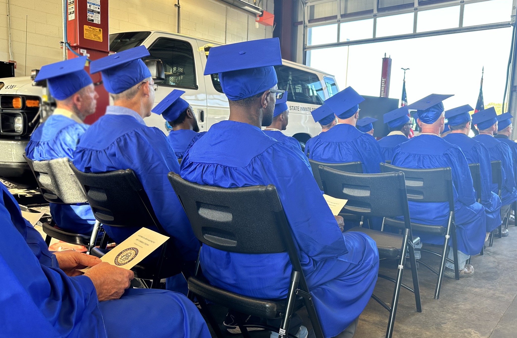 re-entry graduates sit at the ceremony