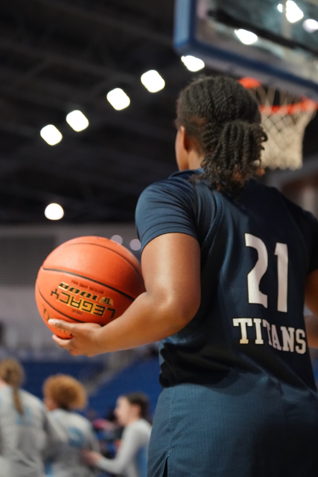Number 21, Aryana Thomas , inbounds the ball against state fair college