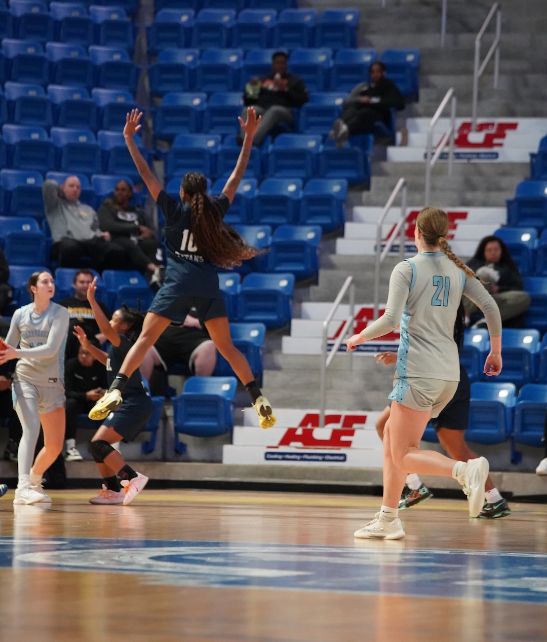 Number 10, Ty'Leishiah Latimore, jumps to defend a pass.