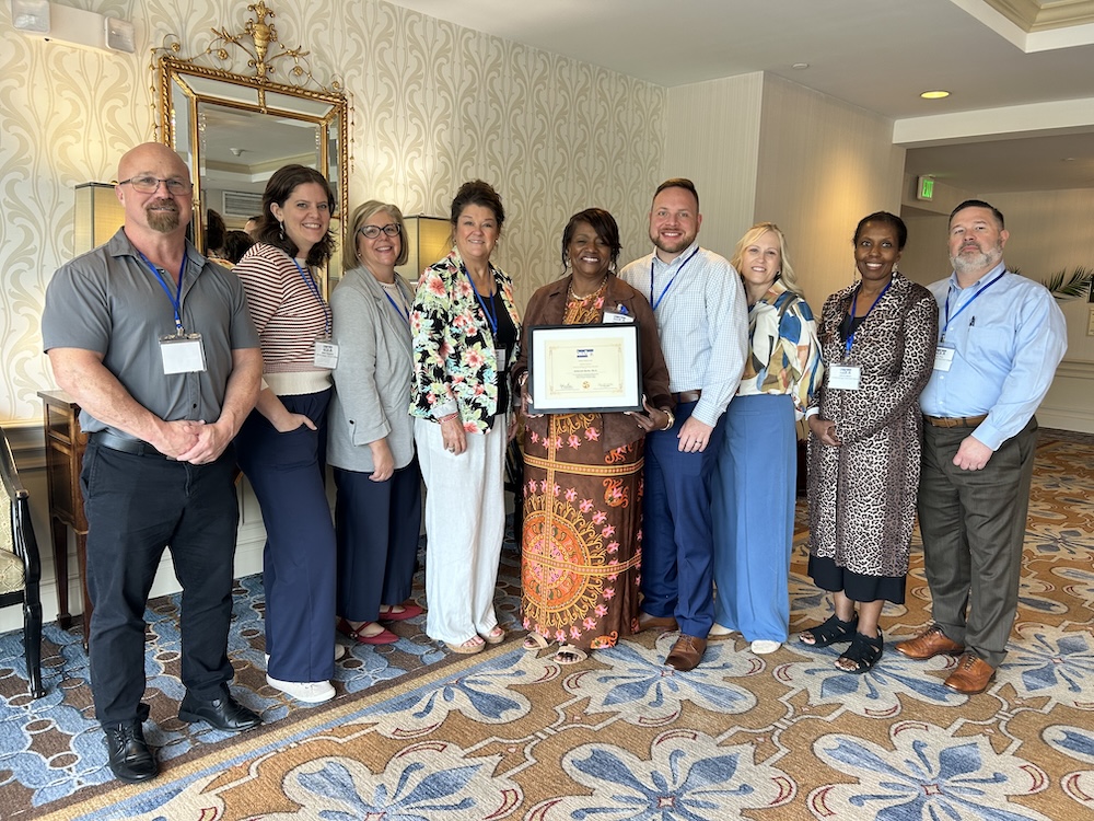 Dr. Deborah Burks Honored for More Than Two Decades of Service to SACCR, stands with her CGTC colleagues.