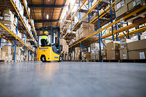 Warehouse man worker with forklift.