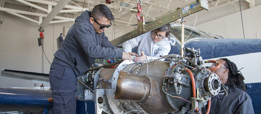 Aviation Maintenance students working on equipment
