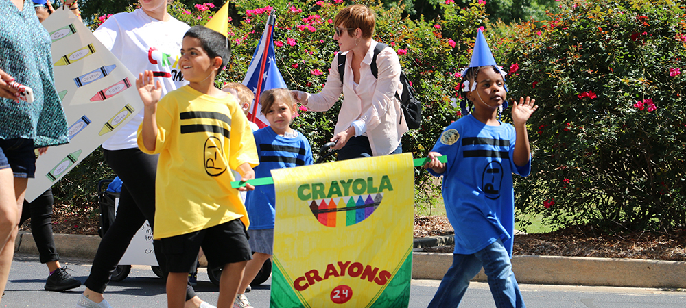 Children dressed as crayons walking in parade