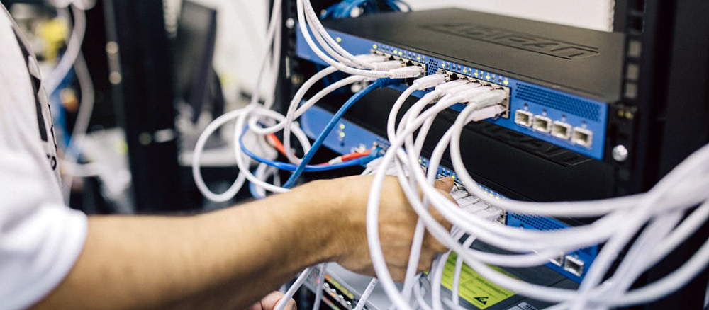 Person handling network cables