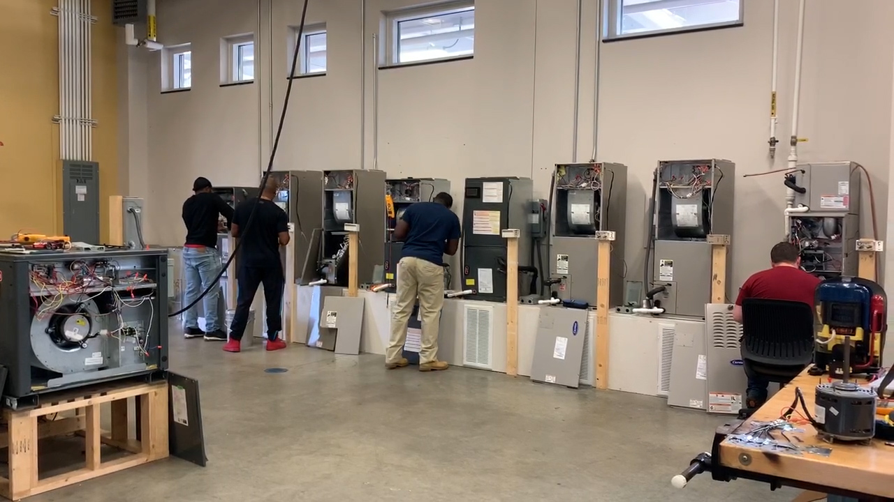 Students work inside the VECTR Center HVAC Lab. 