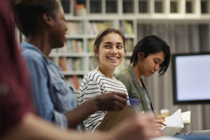 Students smiling at a workshop