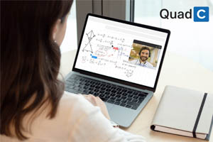 Quad C logo, student looking at laptop